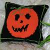 Front of the knitted Halloween cushion